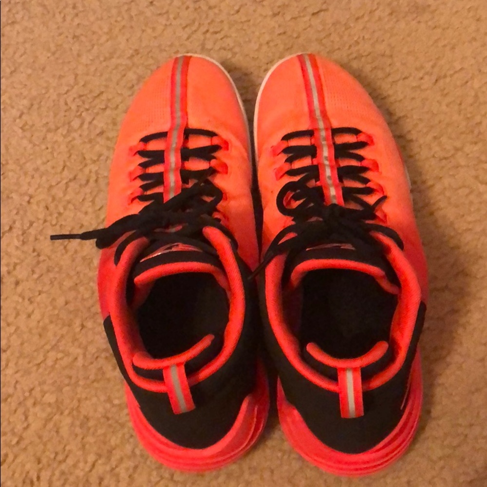 Bright red/orange basketball shoes (Jordans)